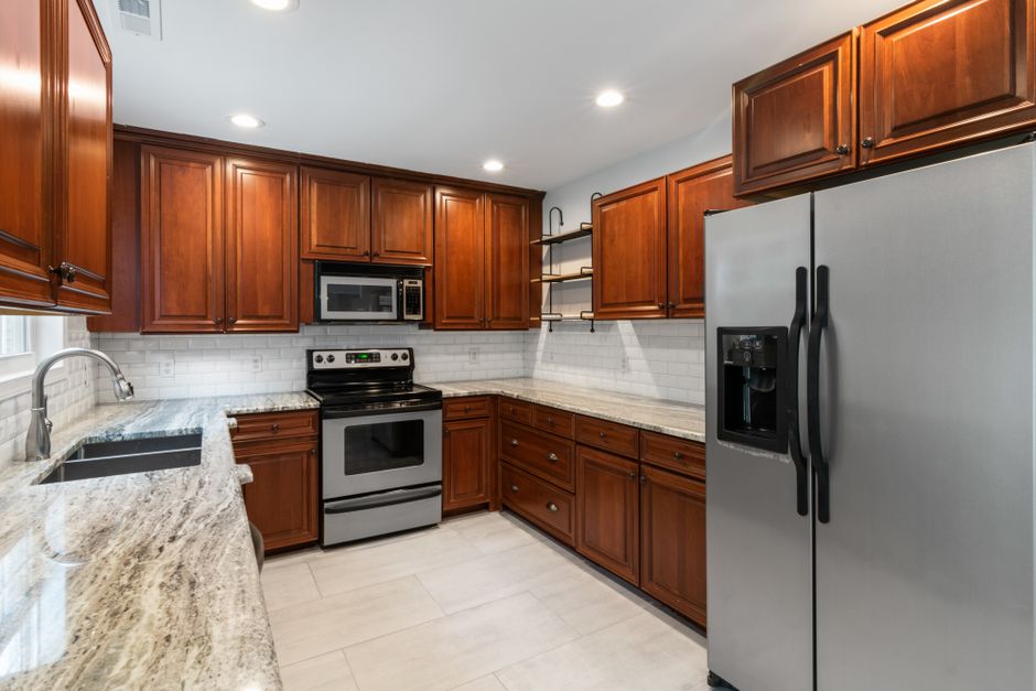Clean modern room with wood cabinets and fixtures