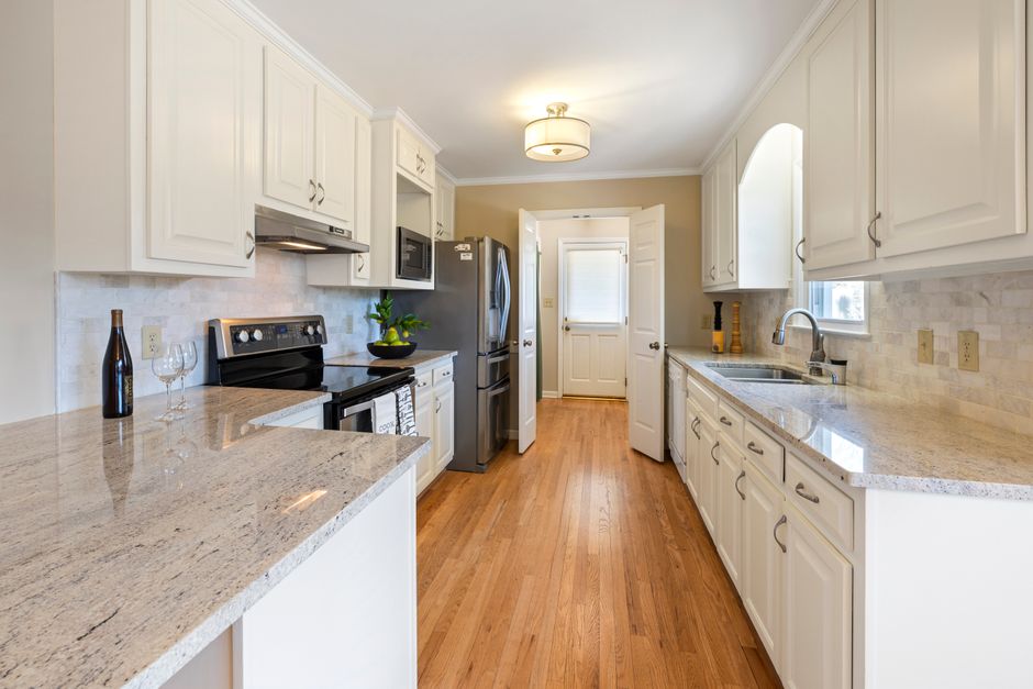 Home interior with light walls, cabinets and a window